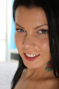 Stunning dark haired babe teases her juicy pussy