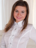 Cute Nataly giggles as she pisses into a bowl